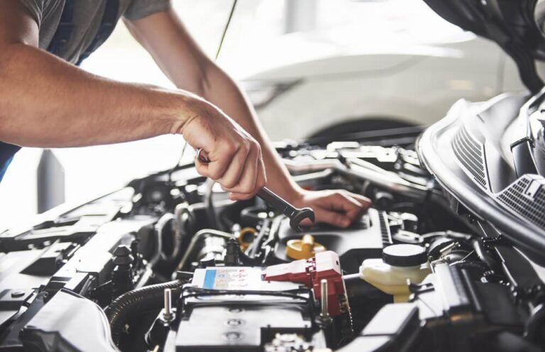 The 14 Best Auto Repair Shops In Calgary 2023   Muscular Car Service Worker Repairing Vehicle 1 768x496 